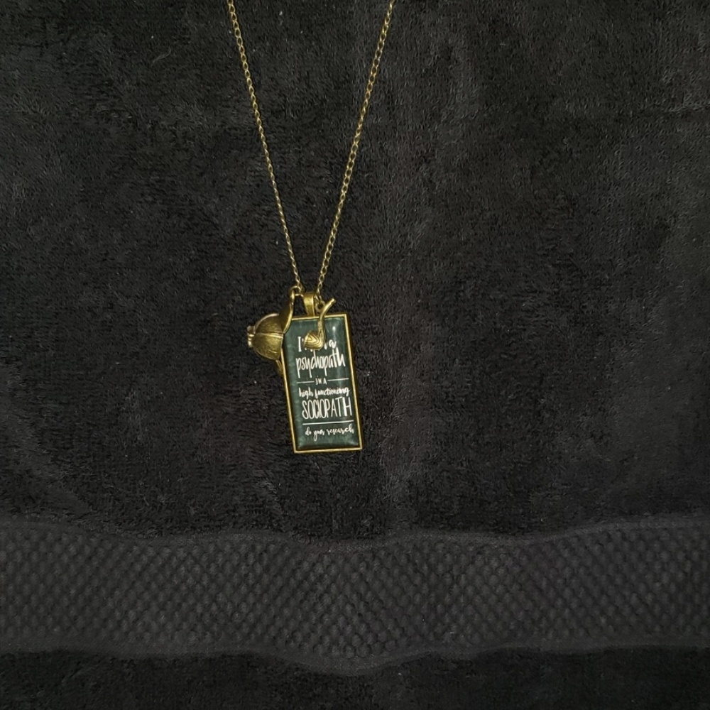 Long bronze necklace with Sherlock pendant